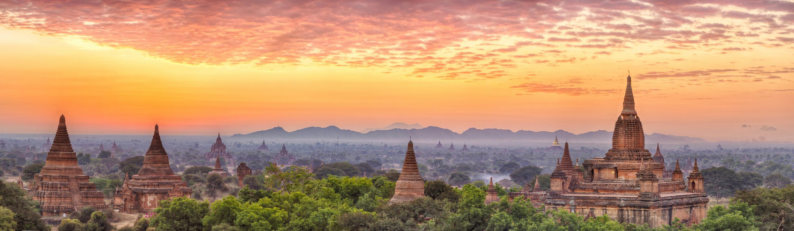 Beautiful sunrise over old pagodas of an ancient city of Bagan, Myanmar. Panoramic hdr photo